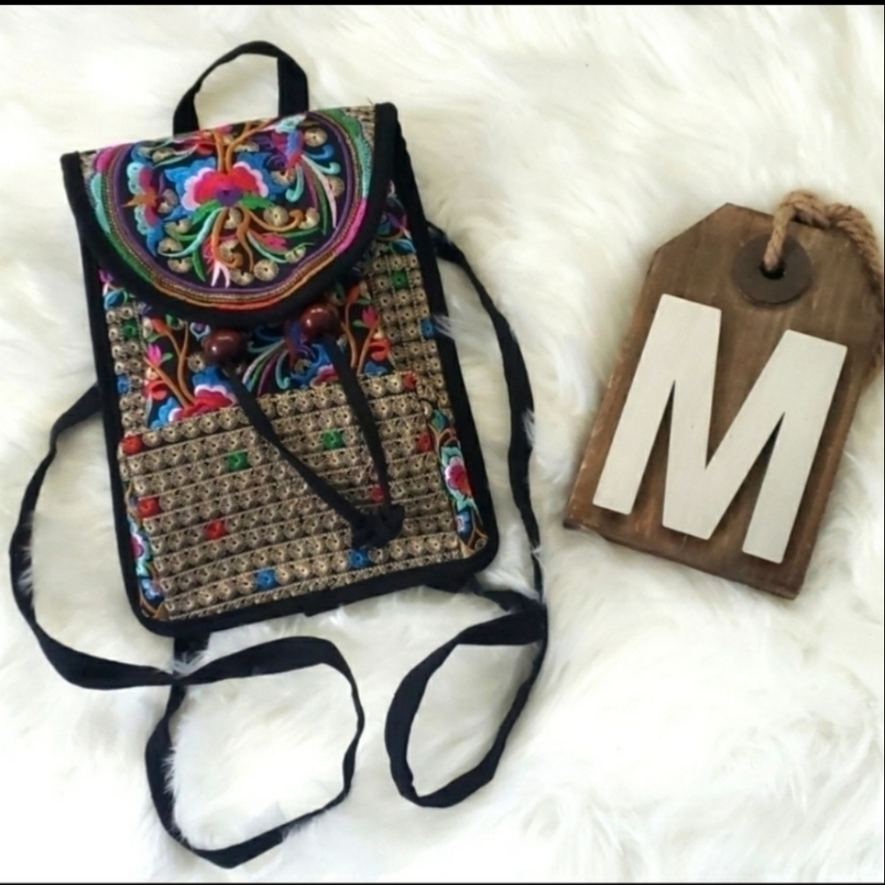 Vibrant embroidered black backpack NWOT